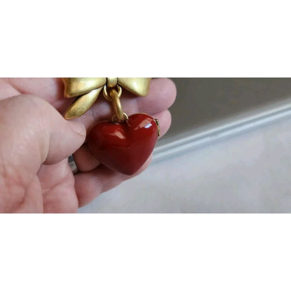 Coach CZ276 Bow Heart Locket Bag Charm-Brass/Ruby